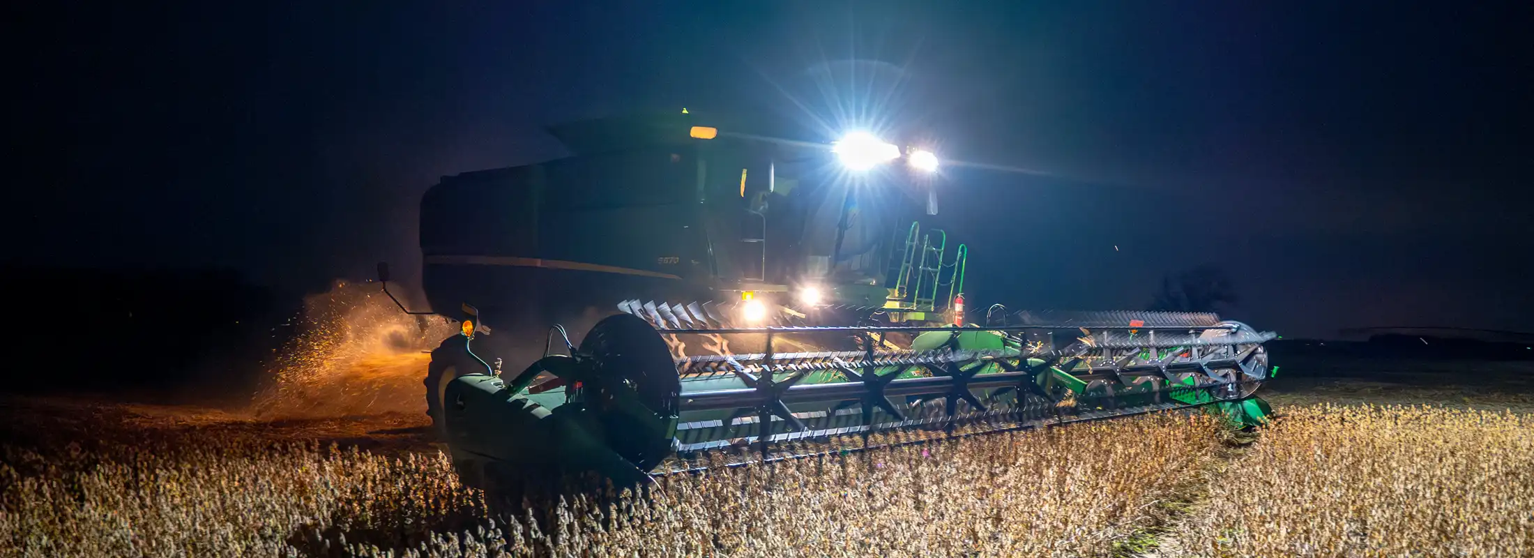 Harvesting soybeans at night.